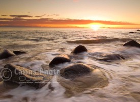Image of sun rising over the Coral Sea, Pebbly Beach, North Queensland, Australia