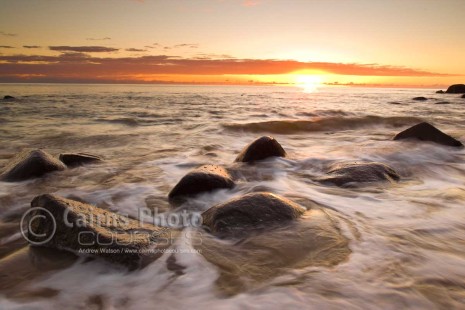 Image of sun rising over the Coral Sea, Pebbly Beach, North Queensland, Australia