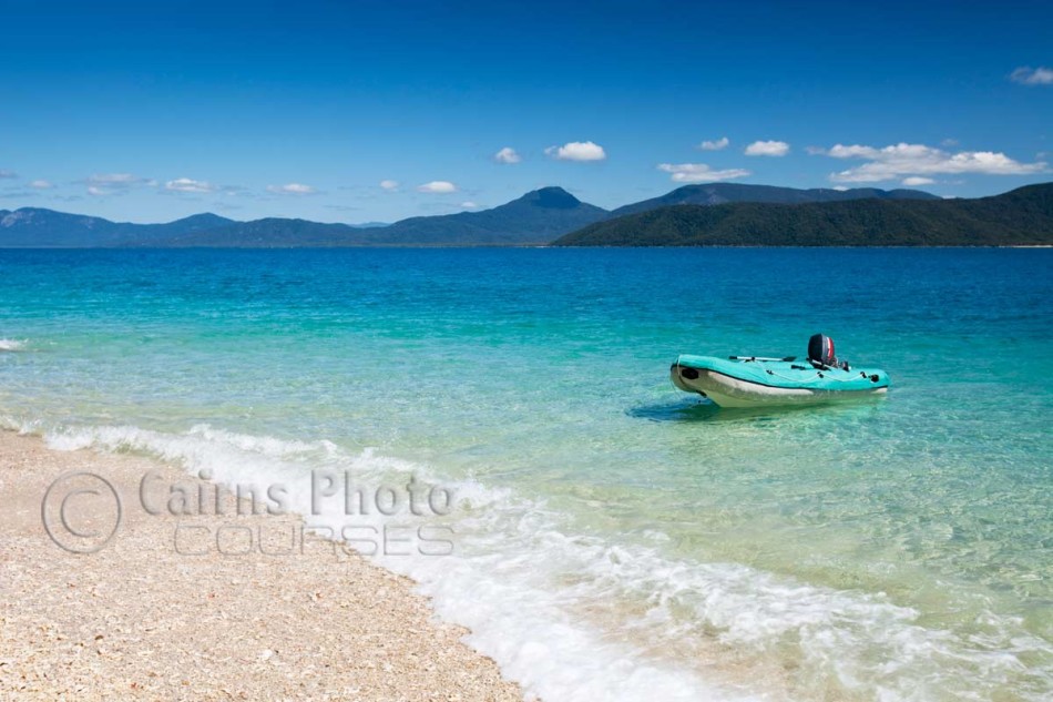 Image of zodiac floating in clear waters of Nudey Beach on Fitzroy Island, Cairns, North Queensland, Australia