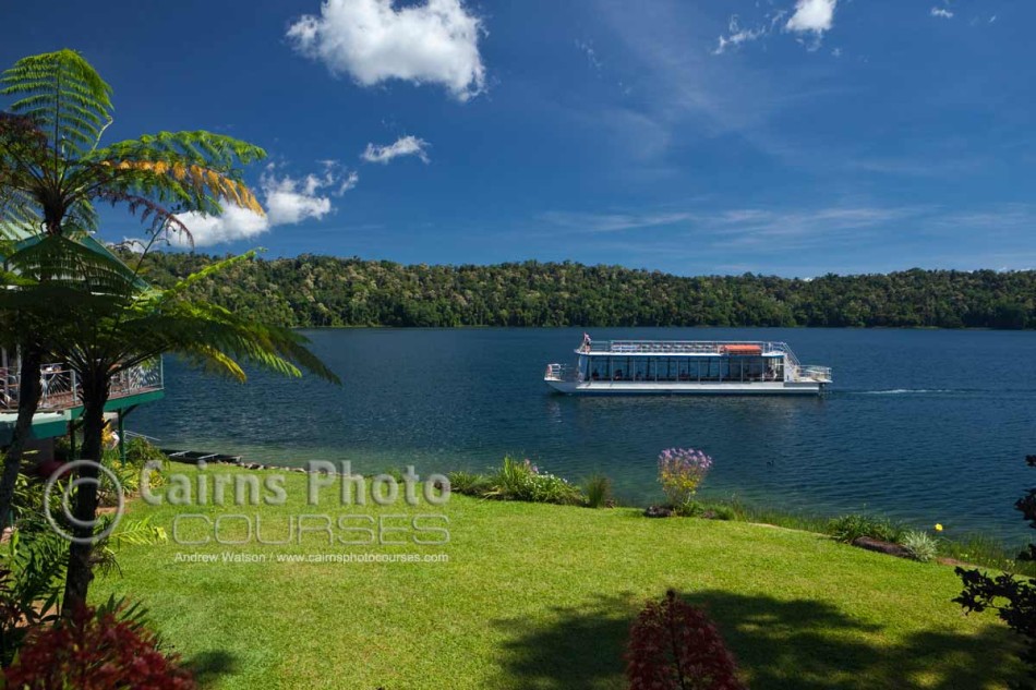 Image of tour boat crossing scenic Lake Barrine, Atherton Tablelands, North Queensland, Australia