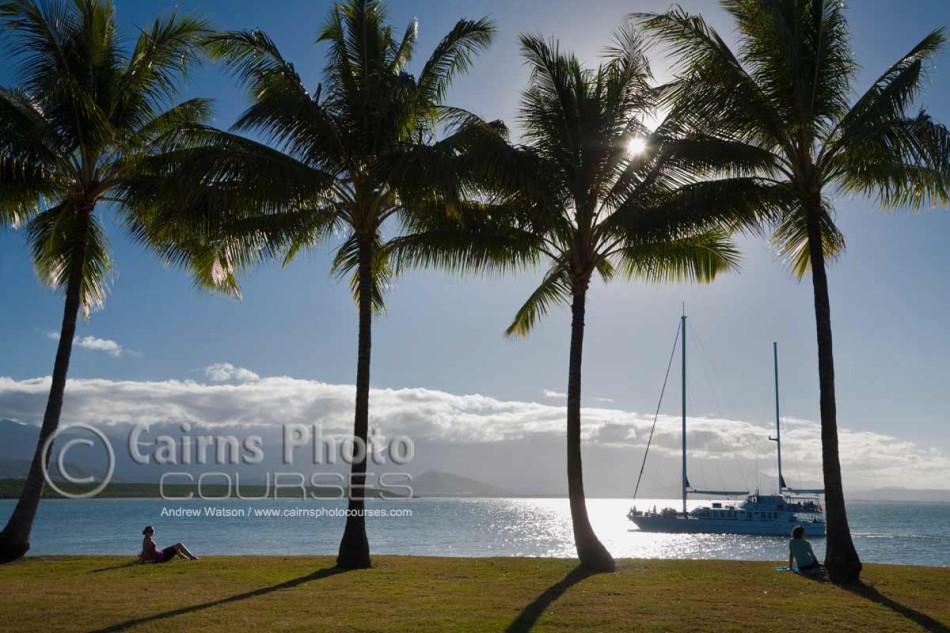 Image of sailboat returning to port at sunset, Port Douglas, North Queensland, Australia