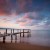 Image of wooden jetty extending into Coral Sea, Cairns, North Queensland, Australia